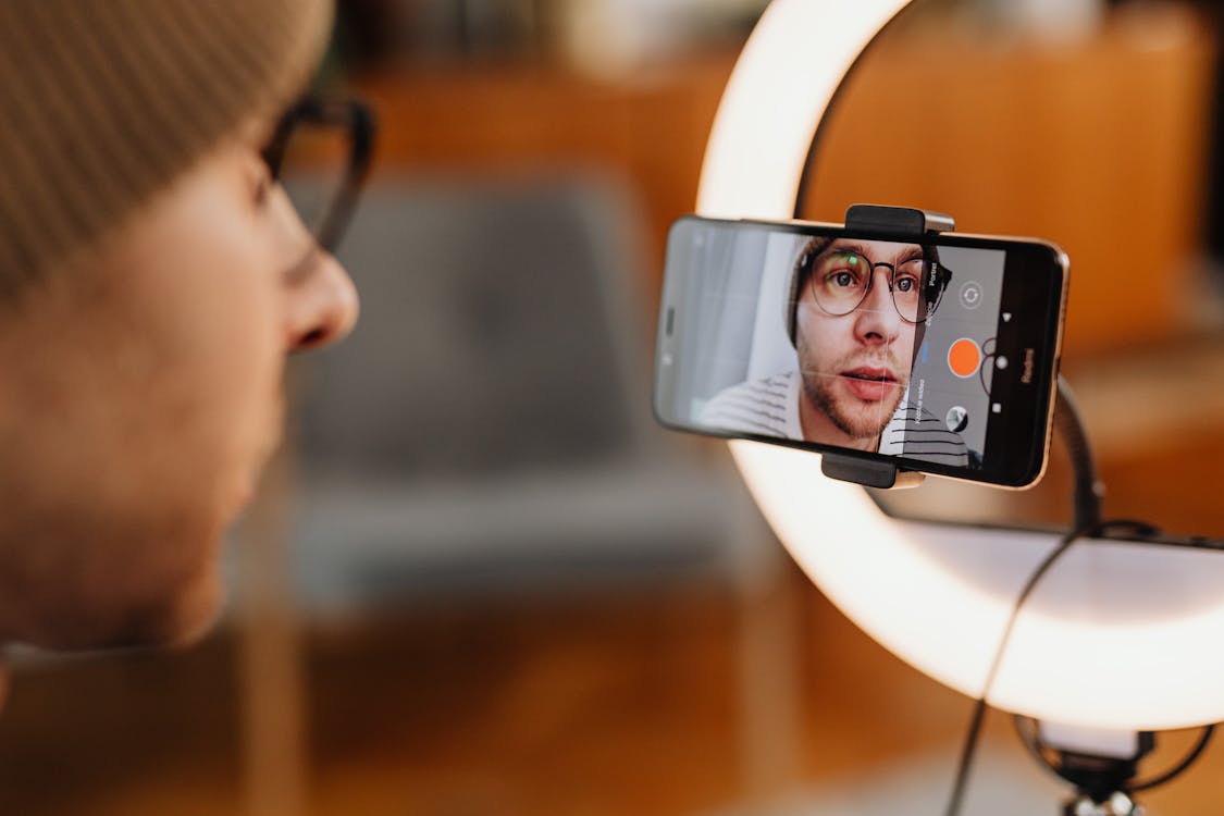 Man filming video content on a smartphone